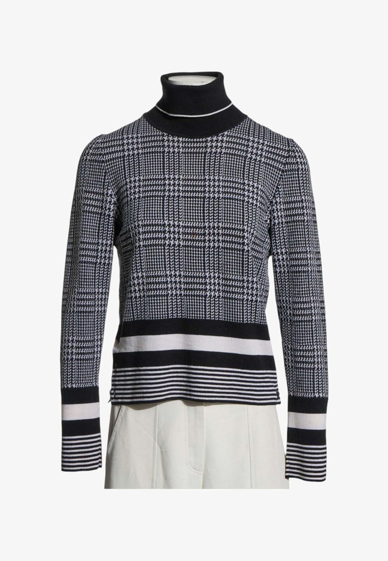 Pull col roulé à motif pied-de-poule noir et blanc avec poignets et ourlet rayés, présenté sur un buste de mannequin.