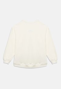 Σταχτοκίτρινο, μαλακό φούτερ με στρογγυλή λαιμόκοψη, κατεβασμένους ώμους και μακριά μανίκια. Διαθέτει ριμπ μανσέτες και τελείωμα, με λείο ύφασμα.