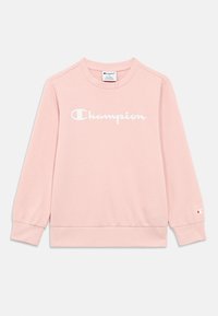 Ανοιχτό ροζ βαμβακερό φούτερ με μακριά μανίκια, ριμπ μανσέτες και τελείωμα, με λευκό λογότυπο «Champion» στο στήθος και διακριτικό λογότυπο στο μανίκι.