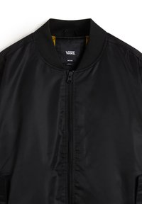 Black bomber jacket with a smooth, shiny texture, zipper closure, and ribbed collar. Interior lined in contrasting yellow fabric.