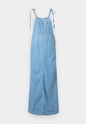 Ljusblå denim overallklänning med justerbara knytband, framfickor och knappdetaljer på sidorna. Lång, löst sittande design.