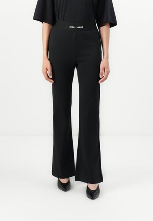 TUVANA - Jogginghose - black