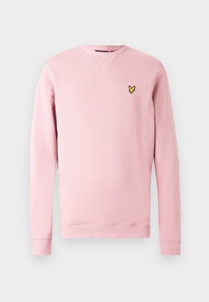 Lyserød sweatshirt lavet af blødt stof med rund halsudskæring, ribkode ved ærmekanterne og en sort logo på venstre bryst.