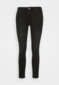 Jeans skinny negros de denim, con una cintura de altura media, cinco bolsillos y detalles en metal. Textura suave con un ligero estiramiento.