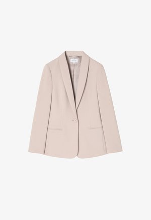 Vaalean beige-takkikangas, jossa on yksi nappi, viistetyt kaulukset, kaksi etutaskua ja sileä rakenne. Muotoiltu istuvuus pitkillä hihoilla.