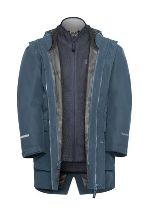 Veste imperméable en bleu foncé avec une doublure en polaire douce. Présente une poche intérieure zippée et des fermetures à pression, ainsi que des accents réfléchissants.