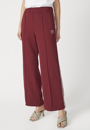 AMINA CREASE - Tracksuit bottoms - burgundy