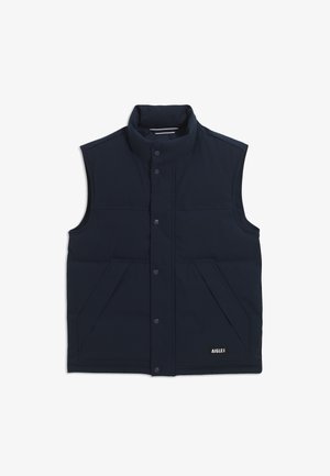 Marineblaue ärmellose Steppweste mit hohem Kragen, zwei vorderen Taschen, Druckknöpfen und einem Logotag unten rechts. Glatte Stoffoberfläche.