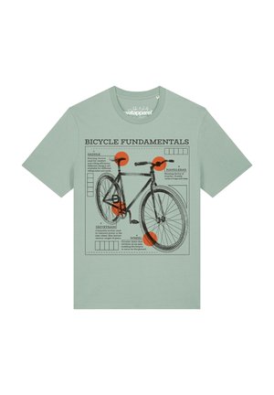 T-shirt vert clair avec un schéma noir de vélo étiqueté "Bicycle Fundamentals" mettant en évidence la selle, le guidon, la transmission et la roue dans des cercles orange.