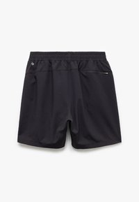 Pantalones cortos negros con una cinturilla elástica, un bolsillo con cremallera en la parte posterior y una tela suave y ligera. Presenta un ajuste relajado.