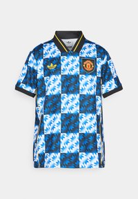 Blau-weiß gemusterte Fußballtrikot mit einem schwarzen Kragen, gelben Akzenten und dem Manchester United-Logo auf der Brust.