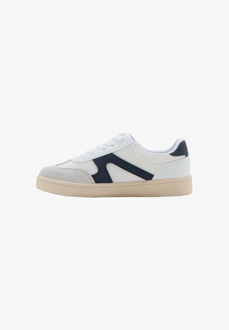 White sneaker with mesh and suede accents, navy side design, padded collar, and beige rubber sole. Features a lace-up closure.