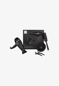 Ensemble professionnel pour sécher les cheveux noirs comprenant un sèche-cheveux, un diffuseur, une brosse ronde aérée et deux clips à cheveux, disposés avec la boîte du produit.