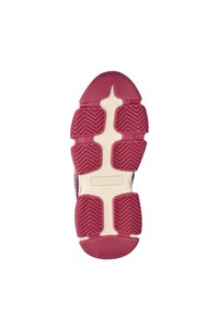 Shoe sole with a textured maroon rubber bottom and cream accents, featuring zigzag tread patterns and a central logo.