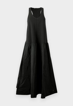 Vestido preto sem mangas com um topo ajustado e uma parte inferior volumosa e franzida feita de um tecido texturizado. Decote redondo simples.