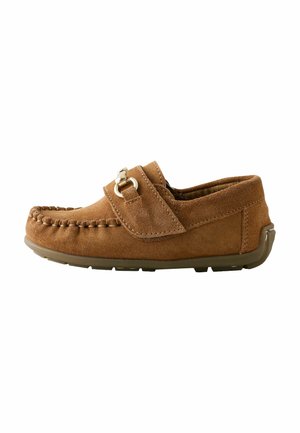 Brown suede moccasin loafer with stitched toe, metal buckle detail, and rubber sole, shown from the outer side on white background.