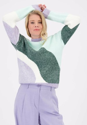 Pull en tricot aux couleurs pastel douces : vert clair, lavande et blanc. Texturé avec des rayures et des blocs de couleur arrondis. Col ras du cou.