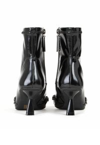 Miriade Tronchetti - nero