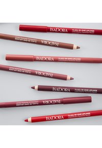 Eight Isadora lip liners in various shades of red and brown, featuring wood-like finish, pointed tips, and clear labeling on each pencil.