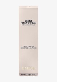 Crème Peeling Douce : boîte rectangulaire beige clair, texte noir, logo doré, incluant la capacité du produit et une description, design minimaliste.