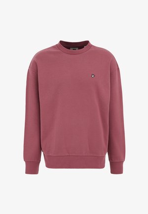 Kohviunist dressipluus pehmest kangast, millel on ümmargune kaelus, pikad varrukad, soonikkoes mansetid ja väike linnu logo rinnal.