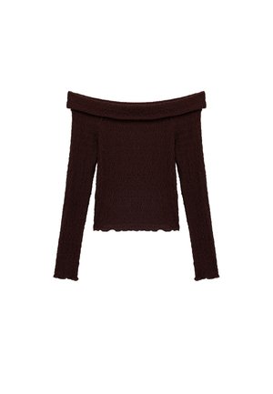 Brun off-the-shoulder top lavet af tekstureret stof. Lange ærmer med bølgemønster og scalloped kant.