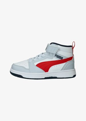 High-top sneakers featuring a white leather upper with grey accents, red logo swoosh, navy collar, white laces, and a strap closure.