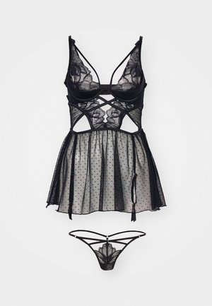 Sort blondekjole med prikmønster mesh, der har en tætsiddende liv, blomsterlacemotiv og matchende sort trusse med snøredetaljer.