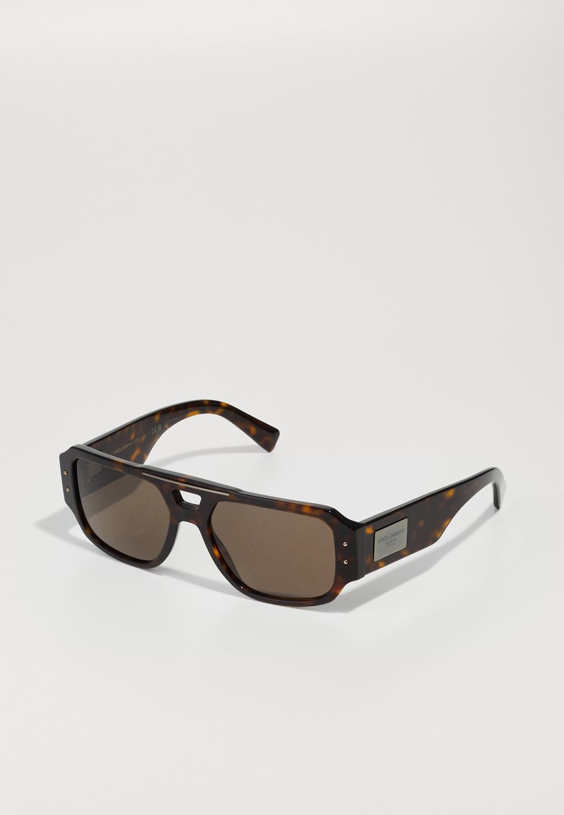 Rectangular sunglasses with a tortoiseshell frame and brown lenses. Features metallic accents on the temples and a wide, structured design.