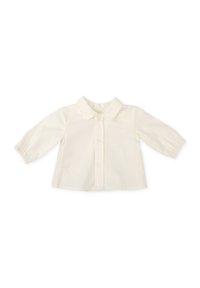 Camisa de algodón color crema con cuello, frente abotonado y mangas largas con puños fruncidos. Diseño liso, textura ligera.