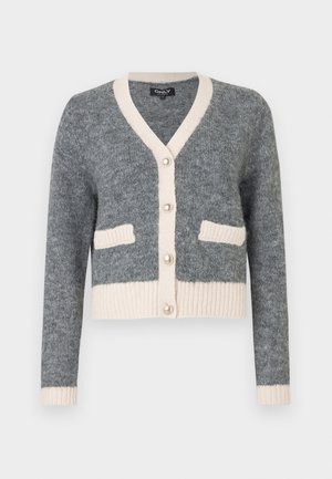 Grey knitted cardigan with a v-neck, beige accents, ribbed hem, and two front pockets. Features large pearl-like buttons.