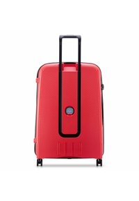 Red hard-shell suitcase with a textured surface, a retractable black handle, and two wheels. Features a central logo and zip closure.