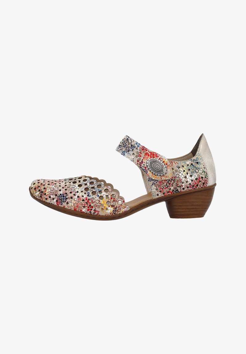 Chaussure à motif floral multicolore avec des découpes, un bord festonné, un petit talon et une lanière sur le cou-de-pied. Fabriquée en cuir.