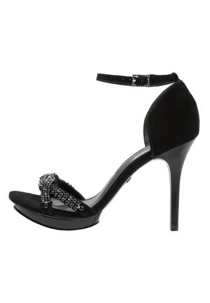 Černé semišové lodičky na vysokém podpatku s ankletovým páskem, zdobené korálkovým předním designem a hladkou černou platformou.