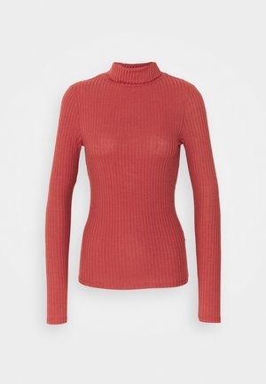 Langärmliges Turtleneck-Oberteil mit Rippenstruktur in Korallenfarbe. Es zeichnet sich durch eine taillierte Silhouette und eine weiche Stoffstruktur mit einem hohen Kragen aus.
