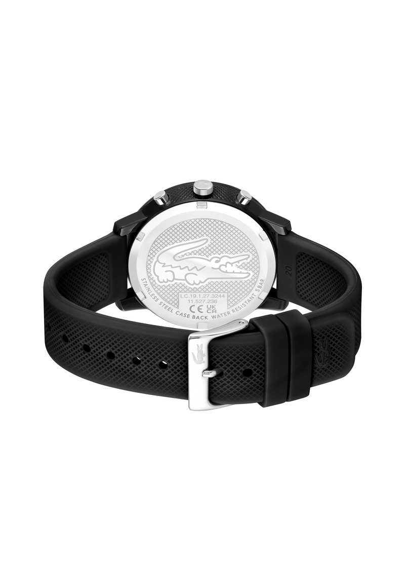 Montre en silicone noir avec un bracelet texturé, fond de boîtier en acier inoxydable arborant un logo de crocodile, et quincaillerie argentée pour la boucle.