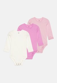 Tre langærmede bodystockings i hvid og nuancer af pink. Blødt bomuldsstof, trykknaplukninger i bunden og rund halsudskæring.
