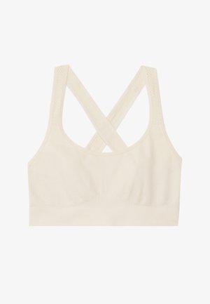 Vaaleanbeige urheiluliivit ristikkäisellä selkäosalla. Valmistettu pehmeästä kankaasta, jossa on teksturoitu vyötäröosa ja saumaton rakenne mukavuutta varten.