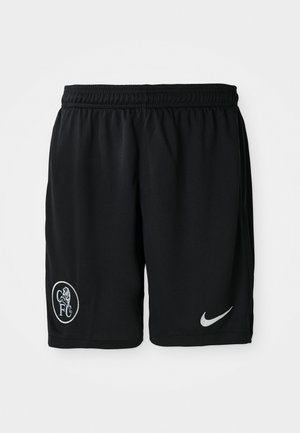 Shorts de sport noirs en tissu léger, dotés d'une taille élastique, d'ouvertures sur les côtés, d'un logo Nike blanc et d'un emblème CFC rond.