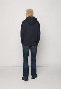 Levi's® 527™ SLIM BOOTCUT - Calças de ganga justas - overhaul