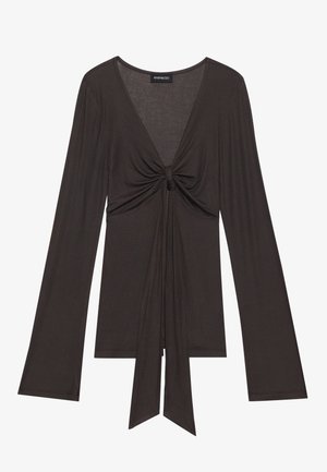 Long-sleeve, dark brown top made of soft fabric. Features a plunge neckline and a front knot detail with ties extending downward.