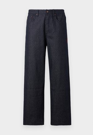 Marineblå denimbukser med løs passform, prydet med et lille hvidt prikkemønster, fem lommer og knaplukning i taljen.