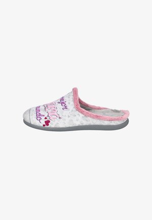 Zapatilla suave y difusa en blanco con patrón de corazones. Presenta un borde rosa y texto colorido. Suela de goma gris claro. Diseño abierto por la parte de atrás.
