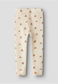Geribbelde legging in crèmekleur met een subtiel patroon van bruine egeltjes, voorzien van een elastische tailleband voor comfort en een getailleerd ontwerp.