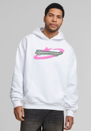 White hoodie with a kangaroo pocket, featuring a large, colorful graphic logo in pink and green on the chest. Soft material, relaxed fit.