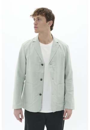 Light green jacket made of fabric with a smooth texture, featuring a notched collar, three buttons, and two front pockets.
