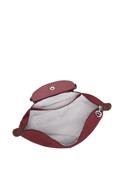 Burgundy leather bag with a top snap closure. Inside features a light-colored lining and an inner zip pocket. Smooth texture, rounded shape.