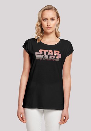 Schwarzes Baumwoll-T-Shirt mit einem grafischen "STAR WARS"-Logo in Pink- und Weißtönen. Kurze Ärmel und lockere Passform. Glatte Textur.