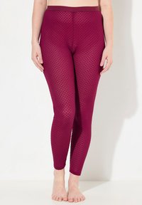 Bordeaux gekleurde leggings met een gemusterd, diamantvormig ontwerp. Hoge tailleband, aansluitende pasvorm en volle lengte. Zacht, rekbaar materiaal.