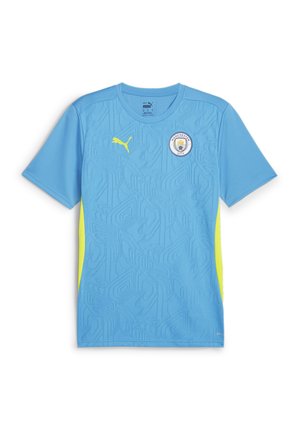 Camiseta de fútbol de manga corta de color azul claro con patrón texturizado, acentos laterales en amarillo y el logo del Manchester City en el pecho. Fabricada con material sintético.